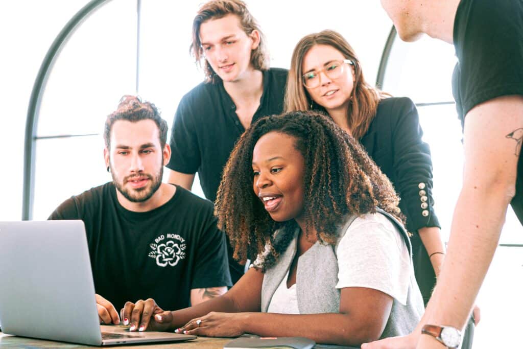 office employees working on a project on a laptop